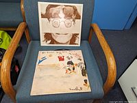 Front cover of the Walls And Bridges vinyl LP showing a split photo of John Lennon with a sepia tone.