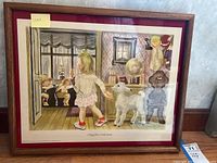 Framed watercolor painting showing a young girl in a floral skirt and red shoes walking inside a room with a white lamb, children visible through a window in another room. Title 'Mary Had a Little Lamb' visible.