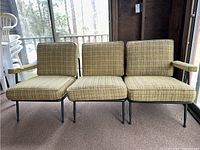 Front view of the 3 piece sofa showing the metal frame and removable plaid cushions