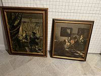 Front view of two framed Johannes Vermeer prints, one larger with a seated male musician, one smaller with two women indoors