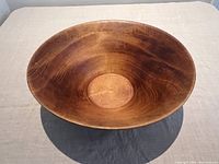 Top-down view of the hand-turned wooden salad bowl showing wood grain and smooth finish.