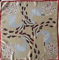 Full view of the scarf showing the bird motif and colors.