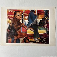 Full color print showing a man beside a carousel horse with a child riding it, printed on heavy stock paper.