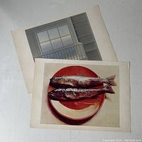 Two Canadian art prints stacked: front shows Mary Pratt's 'Fish on a Red Plate' with two trout on a red plate; back print partially visible with a window and shelves scene by Christopher Pratt.