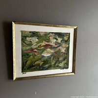 Framed abstract oil painting displayed on wall