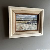 Full frontal view of framed painting hanging on wall
