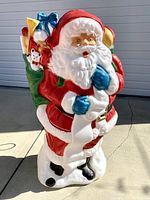 Full frontal view of large vintage blow mold Santa figure showing colors and overall shape.
