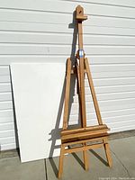 Front view of vintage Mabef art easel with large unstretched canvas behind it showing height and condition.