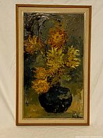 Full view of framed oil painting showing yellow and orange flowers in a dark vase with a muted background