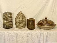 Four pottery items displayed side by side showing size variation and glazing details.