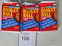 Three sealed 1991-92 Fleer Basketball jumbo packs showing front of packs with branding and featured players listed.
