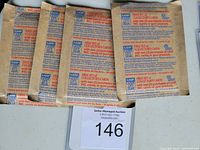 Four unopened packs of 1987 Leaf Baseball Hall of Fame baseball/sports cards in original sealed brown paper packaging with red and blue text.