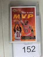 Front side of Michael Jordan basketball card in plastic sleeve showing 'Back to Back MVP' with two images of Jordan in Chicago Bulls uniform.