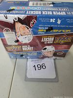 Front and top view of the sealed retail box for 2020-21 Upper Deck Extended Hockey cards showing player images and product branding.