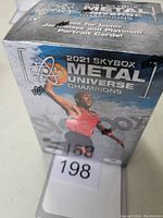 Front view of the sealed 2021 Skybox Metal Universe Champions blaster box with player Jarrett Culver featured.