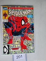 Front cover of Spider-Man #1 comic book showing Spider-Man crouching with web background and Marvel Comics logo.