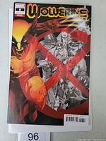 Front cover of Wolverine #8 variant Marvel comic book showing Wolverine character and red X design.