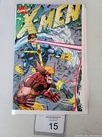 Front cover of X-Men #1 comic book shows Cyclops firing a laser and Wolverine crouching aggressively in his classic costume.