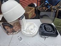 Conair 1600 white hair dryer hood, with original box showing front artwork, base with power cord and instruction manual laid out.