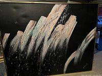 Close-up of the abstract painting showing textured brushstrokes in neutral colors on black background.