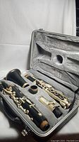 Vintage Simba clarinet disassembled and laid inside grey lined hard shell case