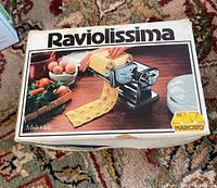 Box labeled 'Raviolissima' showing the Italian-made Marcato ravioli maker set for fresh pasta and ravioli making.
