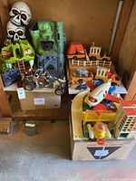 Wide view of all toys showing dune buggy, controller and Fisher-Price sets arranged on shelf
