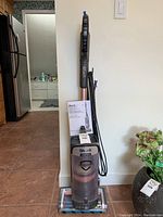Full view of the Shark Vertex upright vacuum cleaner showing power cord, handle, and base.