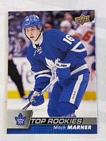 Front of the hockey card showing Mitch Marner in Toronto Maple Leafs uniform, Upper Deck logo, Top Rookies title, and player name and team logo.