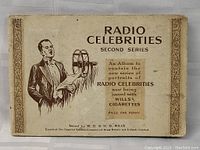 Original album cover titled 'Radio Celebrities Second Series' issued by W.D. & H.O. Wills, Imperial Tobacco company, featuring illustration of a man with a film reel projector.