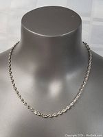 Front view of sterling silver chain necklace displayed on mannequin.