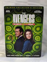 Front cover of the 16-disc collector's edition DVD box set of The Avengers, showcasing Diana Rigg and Patrick Macnee with green geometric background.