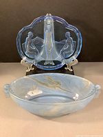 Photo showing both the blue Bohemian glass dressing tray with three female figures and the oval frosted art nouveau fruit bowl with underwater girl design.