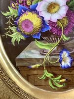 Close-up of porcelain medallion showing detailed floral bouquet brushwork