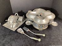 Full view of tea service, sweetmeat server and serving utensils