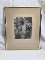 Front view of framed black and white nude photograph showing mat and frame