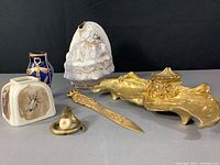 Overview of all six desk accessories on grey surface.