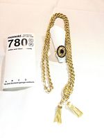 Necklace and ring overview against white background