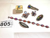 All seven pieces laid out on white background