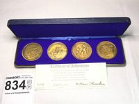 Set of four bicentennial bronze coins in case with certificate of authenticity and lot number card