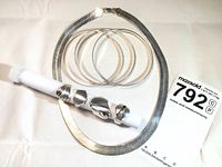 Photo of 34-inch herringbone chain necklace, trio of thin bangles and 4 rings displayed on white cloth, with measuring tool showing ring sizes.
