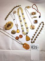 Overview of all 17 costume jewelry pieces arranged on white background