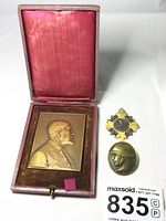Image showing the three bronze medals including Gaston Darboux in case, Joffre medal, and Swiss war pin with a MaxSold lot card