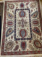 Full view of handwoven rug showing overall pattern and color scheme