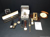 Overview of 12 watches and 2 travel alarm clocks