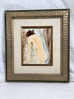 Full front view of framed painting on board