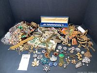 Overview of assortment of jewelry pieces on black background