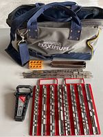 Complete view of the Mastercraft Maximum tool bag with various socket holders and organizing accessories arranged in front.