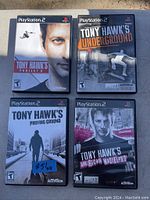 Photo of 4 PlayStation 2 Tony Hawk video game cases showing titles Project 8, Underground, Proving Ground, and American Wasteland.