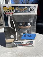 Photo of boxed Pop! Heroes Batman Arkham Asylum vinyl figure, showing front of box with figure inside and box condition.